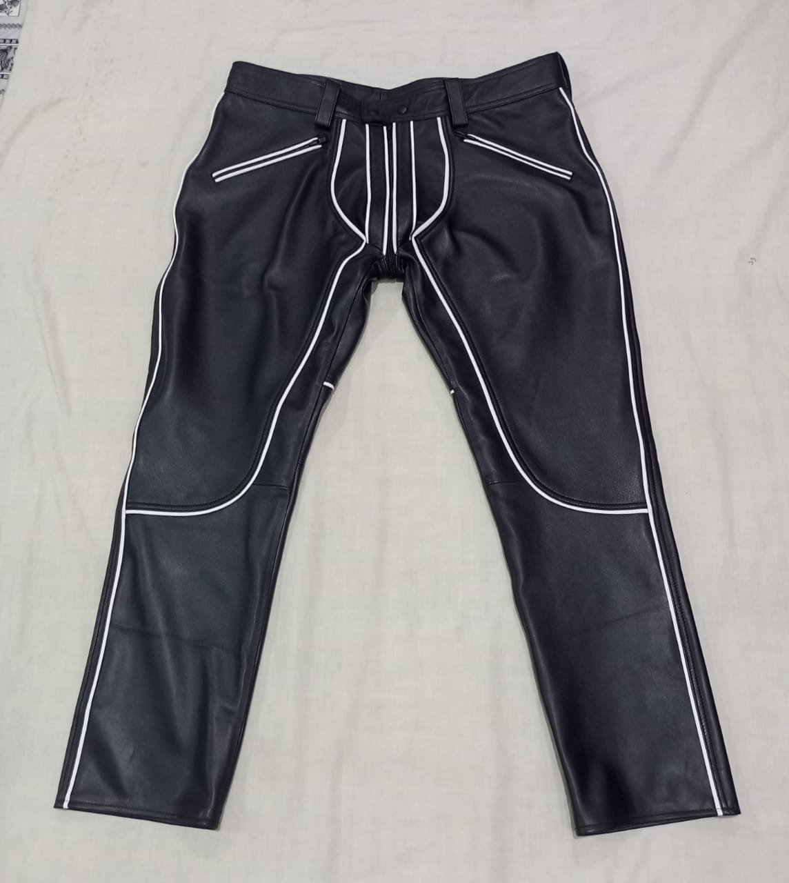 Leather pant with white piping.